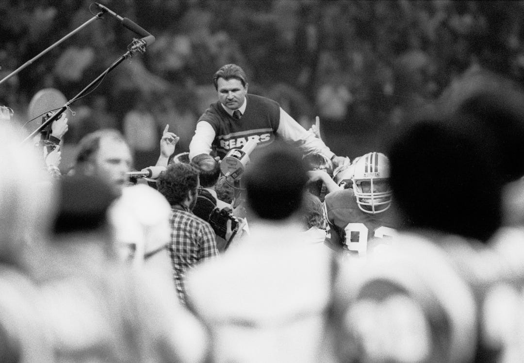 Chicago Bears head coach Mike Ditka is carried off the field after defeating the New England Patriots in Super Bowl XX at the Superdome. The Bears defeated the Patriots 46-10.