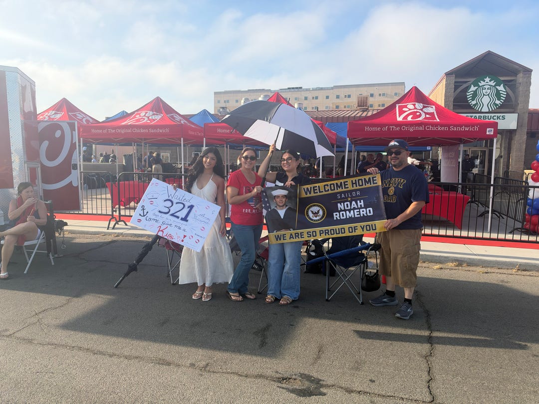 Families arrived before dawn to anticipate the arrival of loved ones returning on the USS Abraham Lincoln in San Diego on Thursday, Oct. 8, 2026.