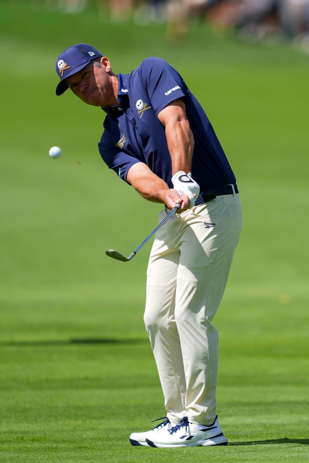 Paul Casey of Crushers GC chips onto the first green during the finals of the LIV Golf Michigan Team Championship at The Cardinal at Saint John's Resort.