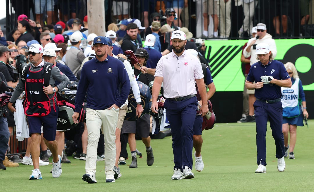 Bryson DeChambeau, Jon Rahm and Cameron Smith walk down the 1st during Day 1 of LIV Adelaide on Feb. 12, 2026 in Adelaide, Australia.
